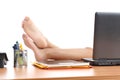 Woman resting at work with the feet over the office table Royalty Free Stock Photo