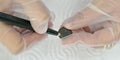 Woman restoring ancient coins