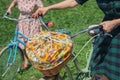 Woman with retro bicycles with a basket for a picnic