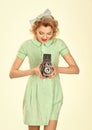 Woman with retro hair, makeup and old camera. media and new technology, journalism Royalty Free Stock Photo