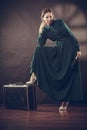 Woman retro style with old suitcase and fan Royalty Free Stock Photo