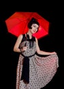 Woman in retro styled dress with red umbrella Royalty Free Stock Photo