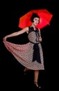 Woman in retro styled dress with red umbrella Royalty Free Stock Photo