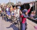 Woman and Rickshaw Street Scene in Delhi, India