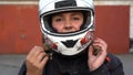 Woman rider putting off helmet portrait of adventerous people, happy face, active hobby