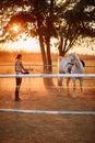 Woman rider  trains a horse on a farm Royalty Free Stock Photo