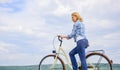 Woman rides bicycle sky background. How to learn to ride bike as an adult. Active leisure. Girl ride bicycle. Healthiest