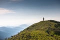 Woman rides bicycle up in the mountains Royalty Free Stock Photo