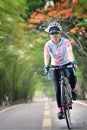 Woman rides bike in speedy on countryside