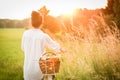 Woman riding bicycle with the basket of fresh food. Royalty Free Stock Photo