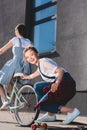 woman riding bicycle and towing her smiling female friend