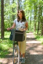 Woman riding a bike with her dog Royalty Free Stock Photo