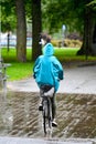 woman riding bike over bridge a rainy day in Orebro Sweden august 9 2023