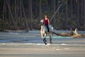 Woman riding horse on the beach Royalty Free Stock Photo