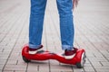 Woman riding on modern red electric mini segway or hover board scooter Royalty Free Stock Photo