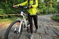 Woman riding mountain bike on forest trail Royalty Free Stock Photo