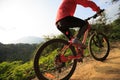 Woman riding mountain bike on forest trail Royalty Free Stock Photo