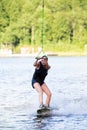 Woman riding wake board