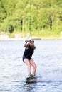 Woman riding wake board Royalty Free Stock Photo