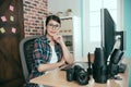 Woman right sitting in photo editing office Royalty Free Stock Photo