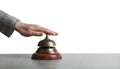 Woman ringing hotel service bell at stone table Royalty Free Stock Photo