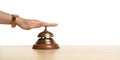 Woman ringing hotel service bell at table Royalty Free Stock Photo