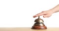 Woman ringing hotel service bell at table Royalty Free Stock Photo