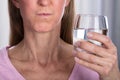 Woman Rinsing And Gargling With Water