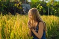 A woman and a ripe harvest of rice. Rice porridge, rice flakes, Royalty Free Stock Photo