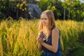 A woman and a ripe harvest of rice. Rice porridge, rice flakes, Royalty Free Stock Photo