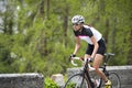 Woman road cycling uphill Royalty Free Stock Photo