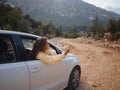 Woman on road trip traveling by rental car Royalty Free Stock Photo