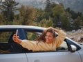 Woman on road trip traveling by rental car Royalty Free Stock Photo