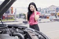 Woman on the roadside with broken car Royalty Free Stock Photo