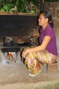 Woman is roasting exclusive coffee beans of the civet cats, Bali Royalty Free Stock Photo