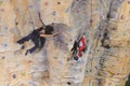 Woman on rock wall in sport centre