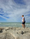 Woman on rocky beach in Captiva