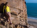 Woman on rocky beach Royalty Free Stock Photo