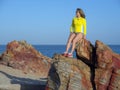 Woman on rocky beach Royalty Free Stock Photo