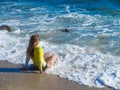 Woman on rocky beach Royalty Free Stock Photo