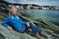 Woman on a rocky seashore