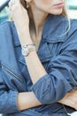 Woman with Rolex Datejust watch and blue denim overalls before Luisa Beccaria fashion show,