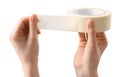 Woman with roll of masking tape on white background, closeup Royalty Free Stock Photo