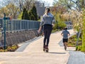 A woman is rollerblading riding skates on The 606 Bloomingdale Trail. Streets of Chicago Royalty Free Stock Photo