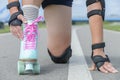 Woman rollerskater wearing knee protector pads Royalty Free Stock Photo