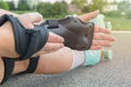 Woman rollerskater wearing wrist guards protector pads Royalty Free Stock Photo