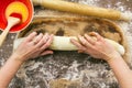 Woman rolling cinnamon roll Royalty Free Stock Photo