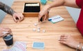 Woman rolling dices while playing at home with partner. Close up caption Royalty Free Stock Photo