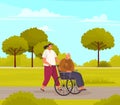 Woman rolls old man in wheelchair. Grandfather walks and sits in disabled carriage in city park Royalty Free Stock Photo