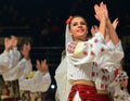 Woman in Romanian traditional outfit perform during dancesport competition